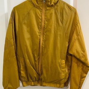 Mustard yellow windbreaker. Like new condition. Size medium.